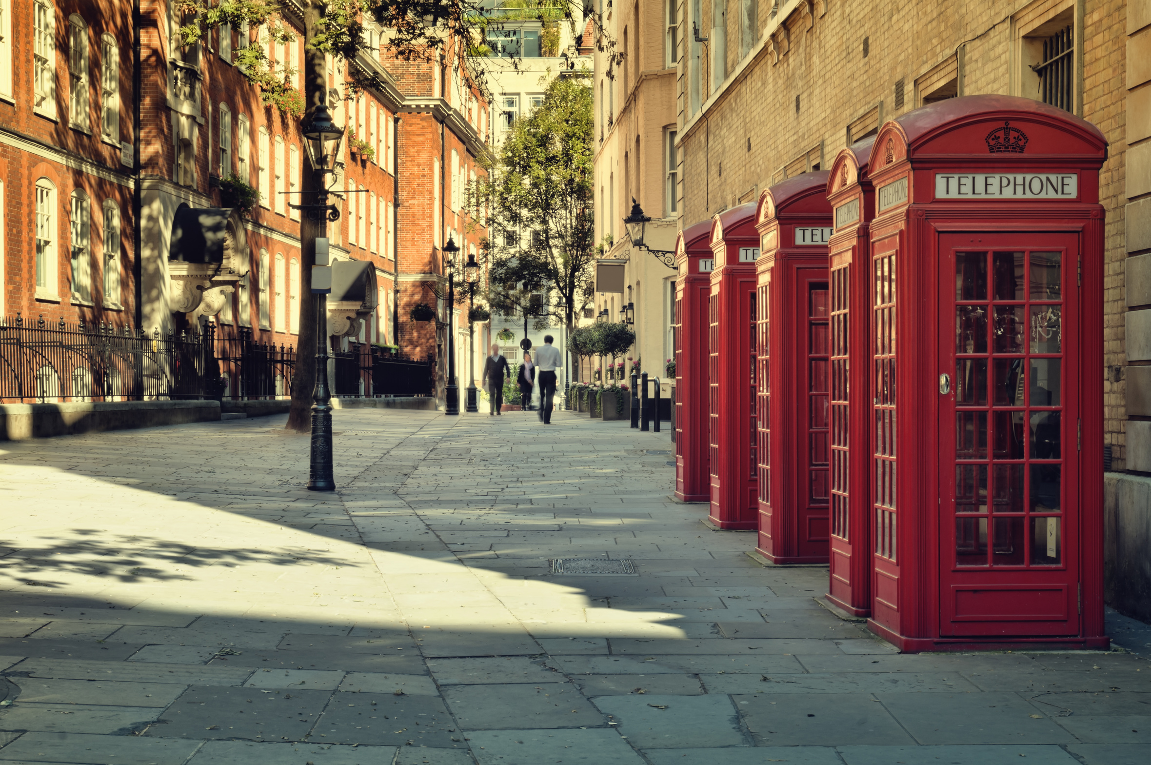 Street with a Tradicional Red Phone Boxes near Covent Garden, London