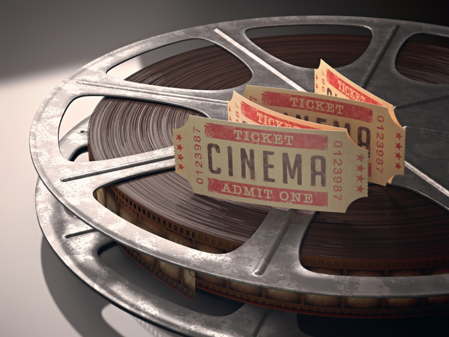 Cinema ticket over rolls of film. Concept of festival of cinema.