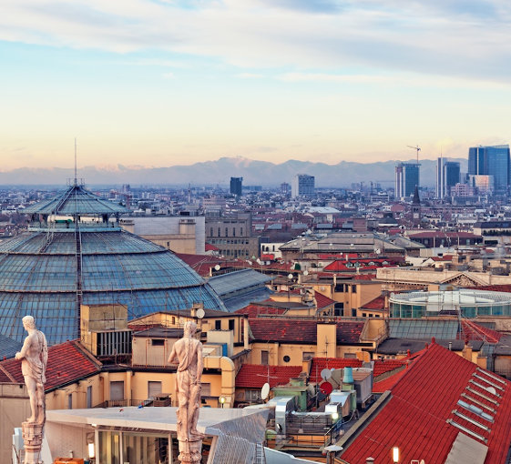 View of Milan from the rooftoop of  “Duomo di Milano”. Statues of  Duomo of Milan, Galleria Vittorio Emanuele II and skycrapert of Porta Nouva als visible.